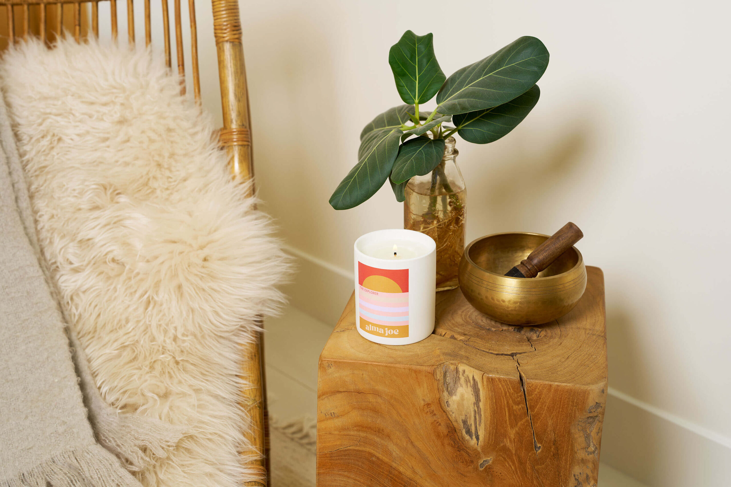 The explorer candle on wooden side table